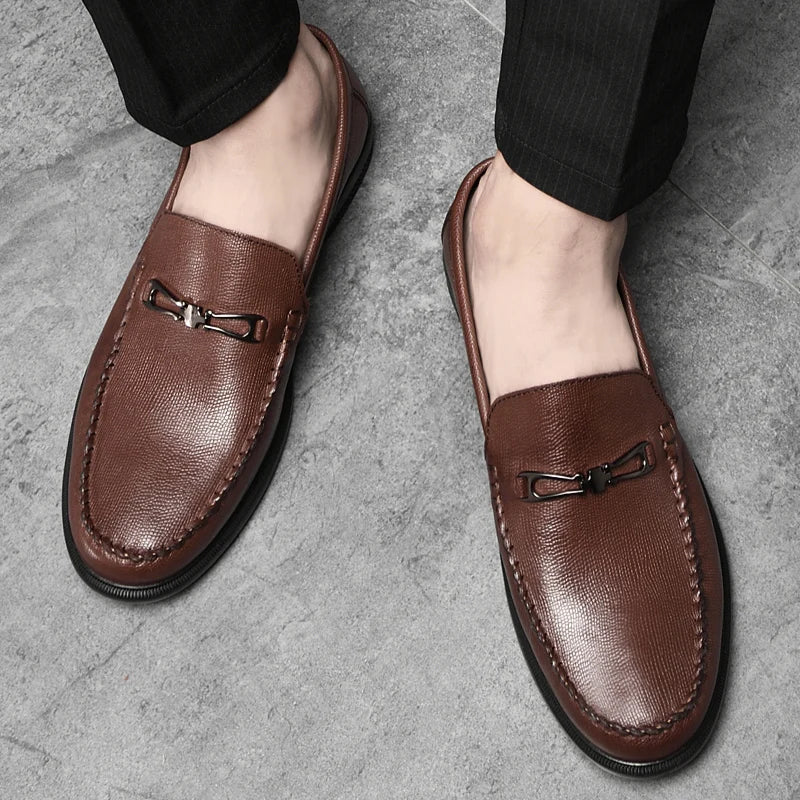 Model wearing men's genuine leather loafers, demonstrating fit and style in a professional setting.