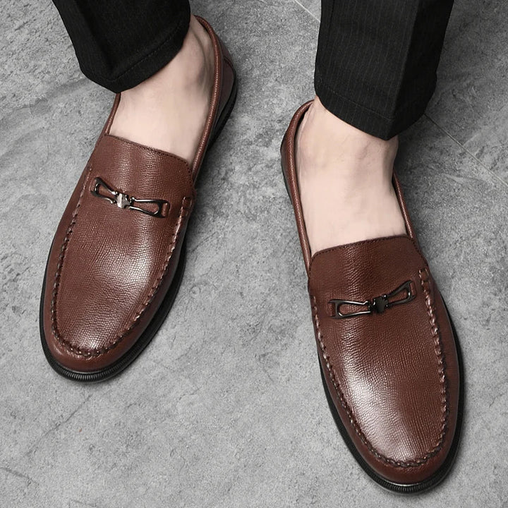 Model wearing men's genuine leather loafers, demonstrating fit and style in a professional setting.