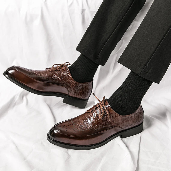Men's genuine leather Oxford dress shoes displayed on a shelf, fashionable and premium quality formal shoes.