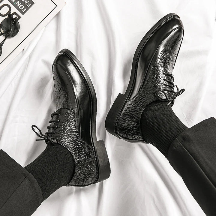 Pair of men's genuine leather Oxford shoes, sophisticated & stylish, ideal for any formal occasion.