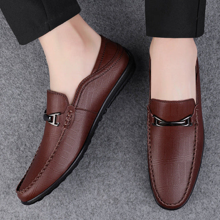 Close up of sole on men's genuine leather slip-on loafers, showcasing grip and durability