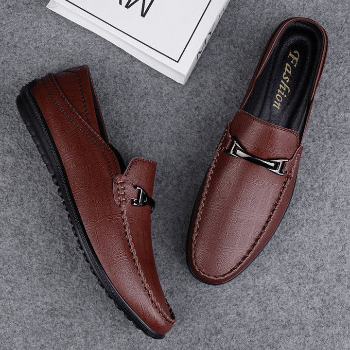 Elegant men's genuine leather slip-on loafers on a white background, studio shot