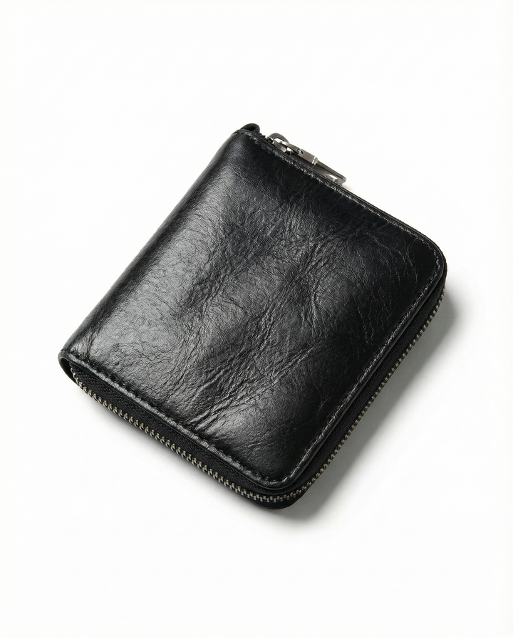 Close-up of the textured genuine leather of a men's zip wallet