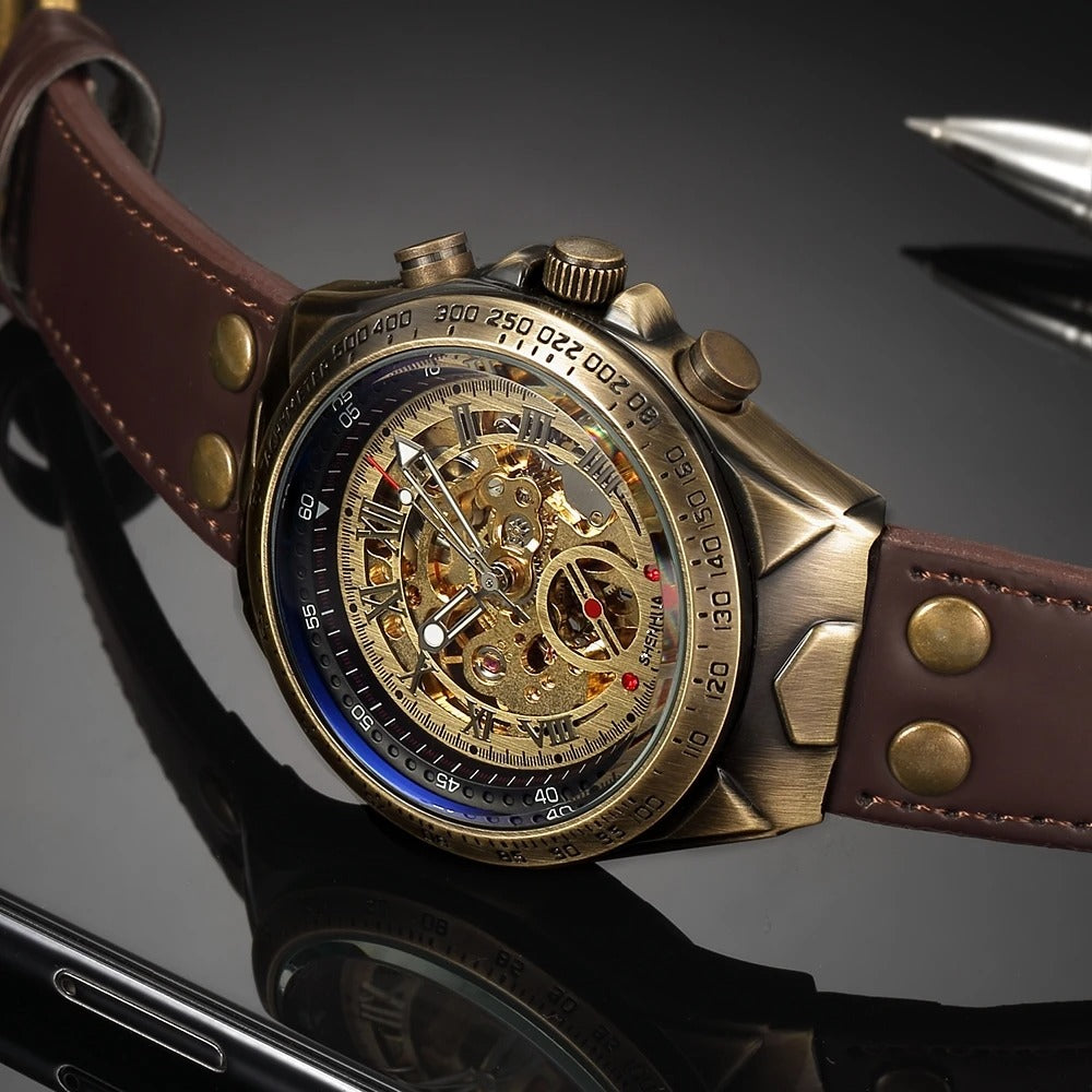 Close-up of a men's vintage style gold skeleton dial automatic watch, revealing inner workings