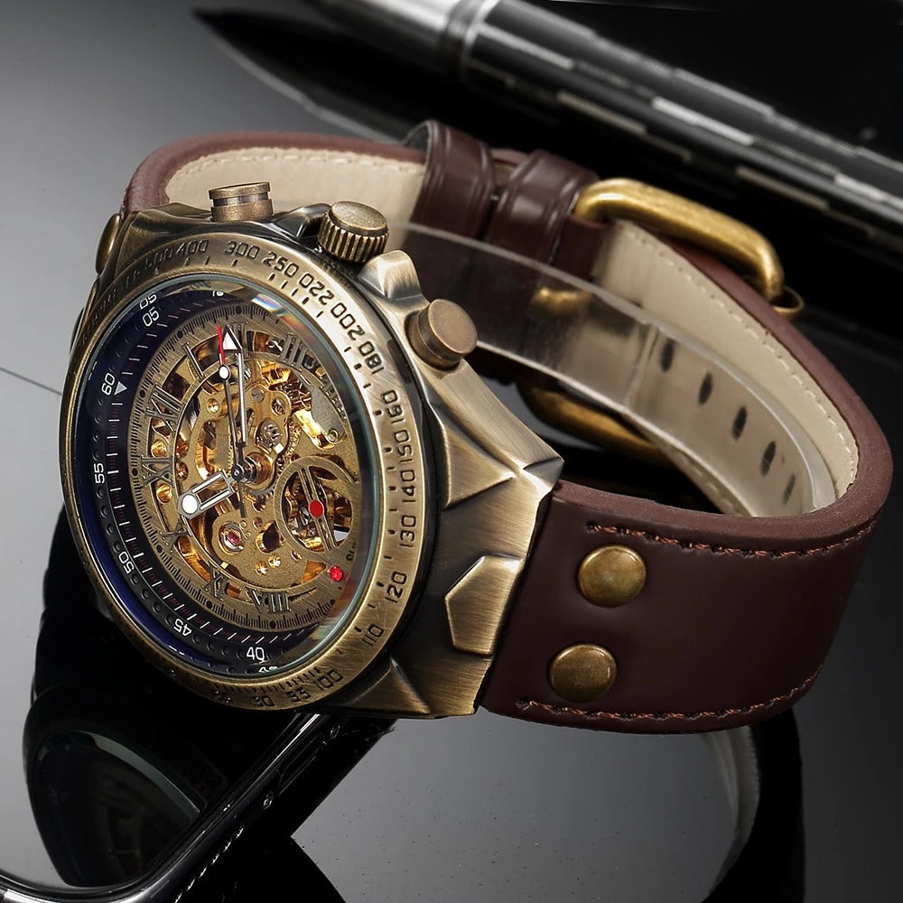 Gold automatic men's watch with see-through skeleton dial and black genuine leather strap on a wrist