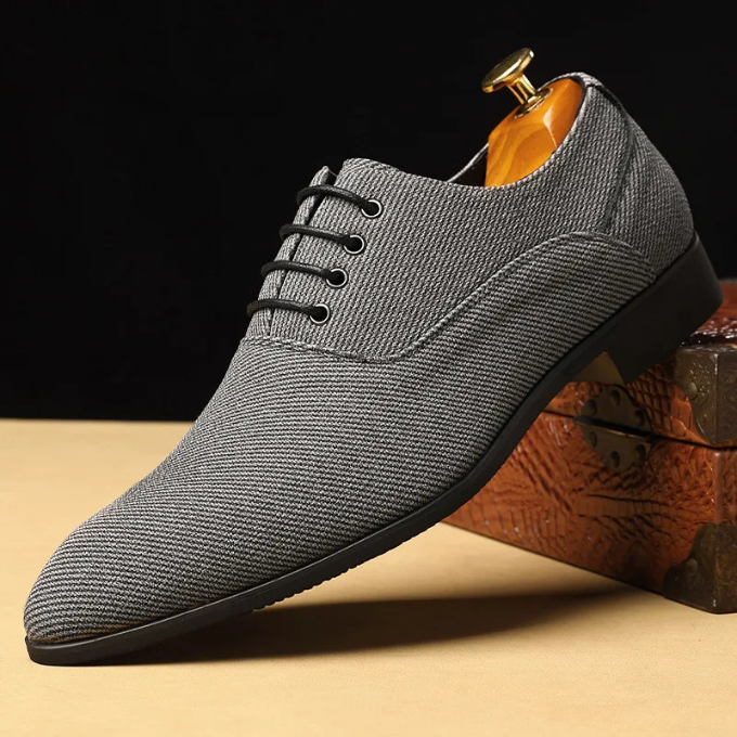 Close-up of men's blue woven derby shoes, detailed texture of casual men's footwear