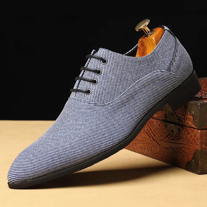 Pair of men's blue woven derby shoes, front view, comfortable casual footwear