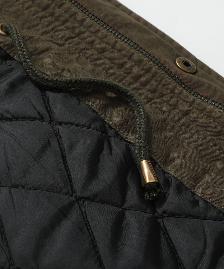 Versatile men's field jacket, showcasing its utility features and soft quilted interior.