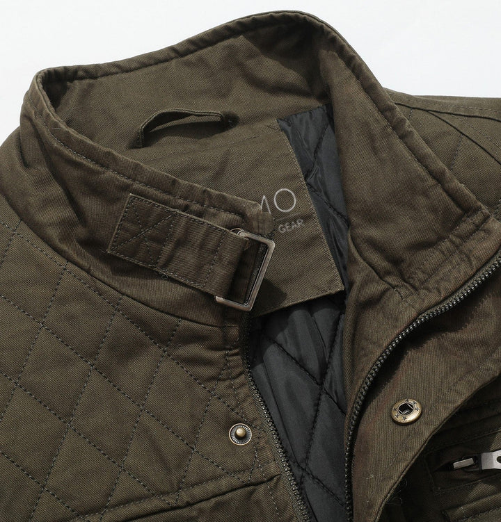 Men's green field jacket with a stand-up collar and visible quilted lining.