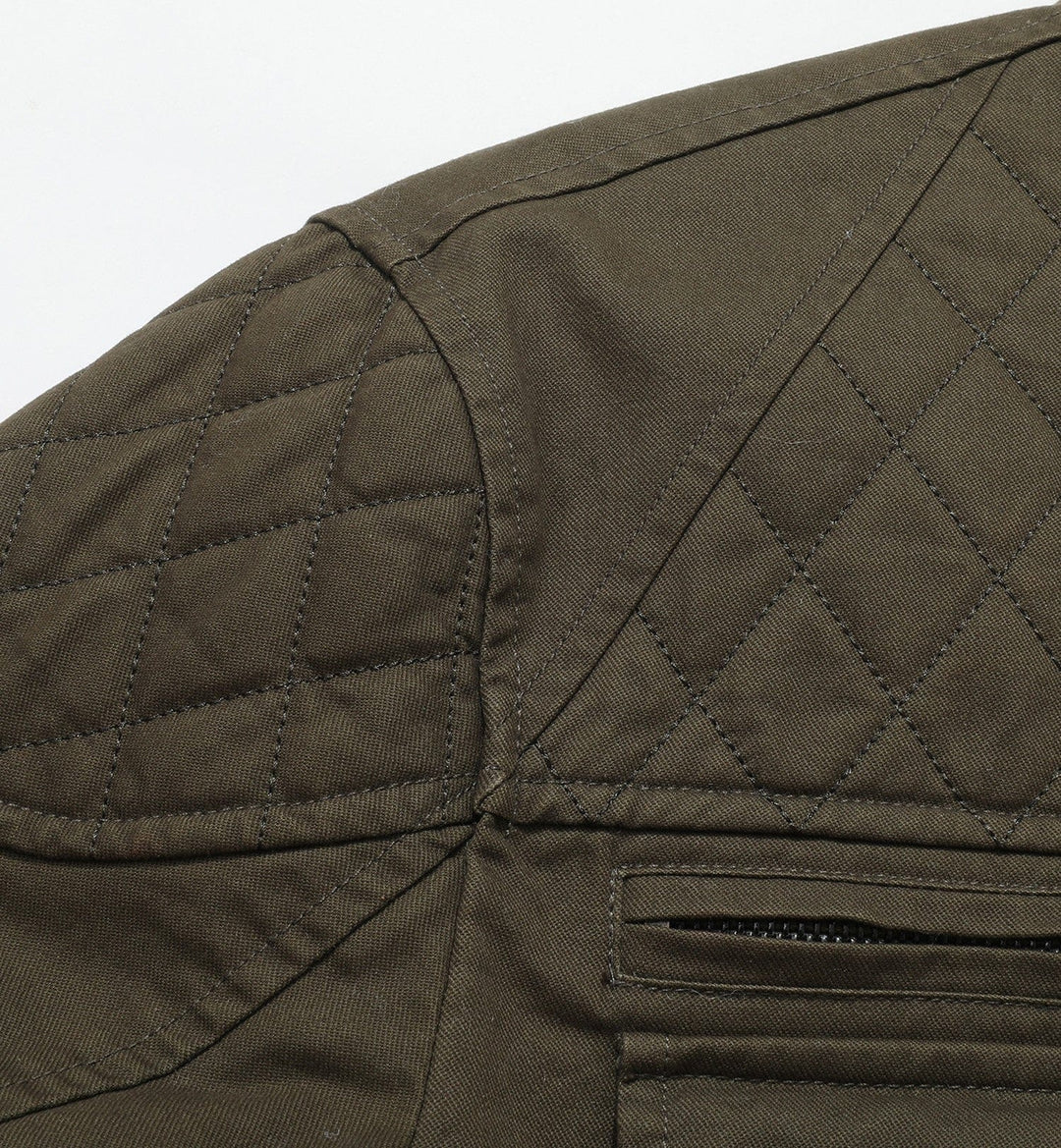 Back view of a men's utility field jacket, highlighting its durable construction.