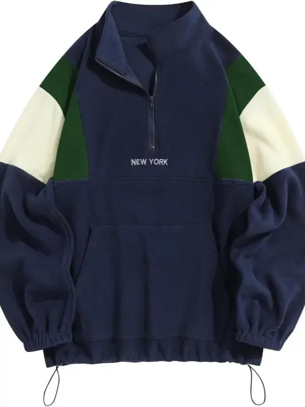 Outerwear men's fashion: half-zip mock neck pullover, color block pattern.