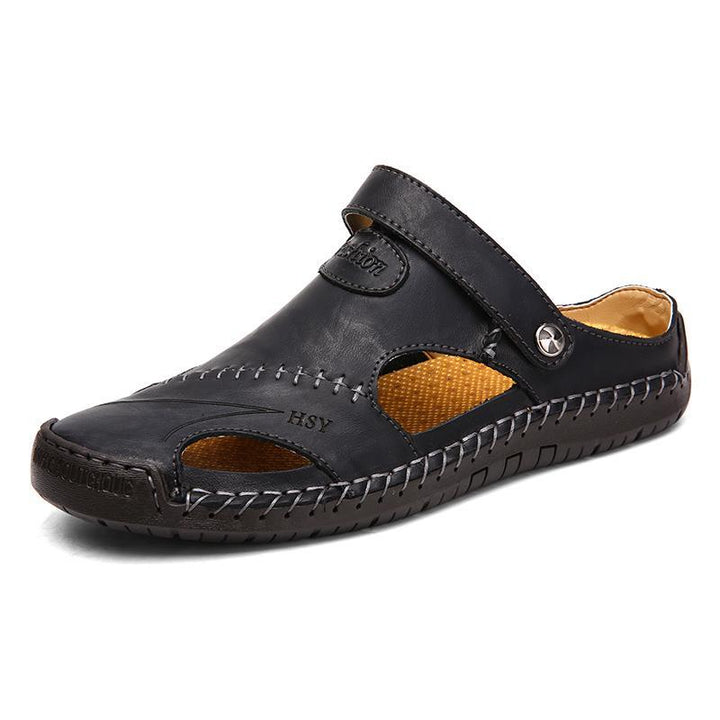 Detail perspective of the hand-stitched seam on men's closed-toe genuine leather sandals.