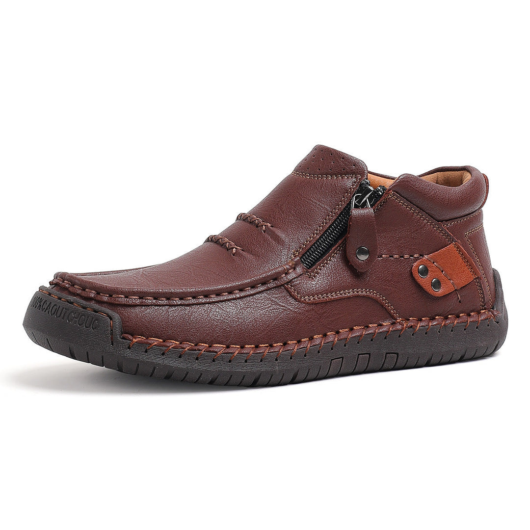Men's hand-stitched high-top leather boots in a classic brown finish, perfect for casual or dress.