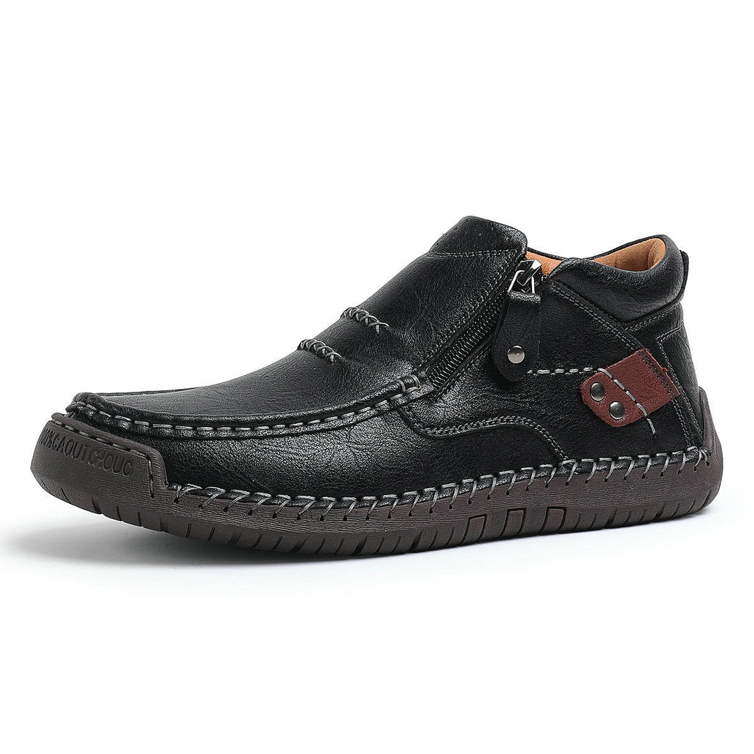 Detailed shot of the lace-up design on men's high-top orthopedic leather casual boots.