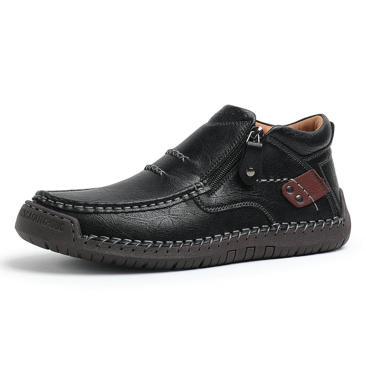 Detailed shot of the lace-up design on men's high-top orthopedic leather casual boots.
