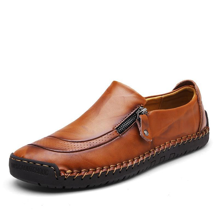 Close-up of the sole & hand-stitching on men's slip-on leather loafers with zipper
