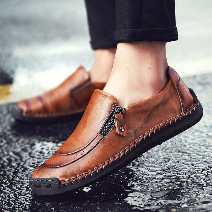 Stylish men's black leather loafers, hand-stitched, zipper accent, comfortable dress flat