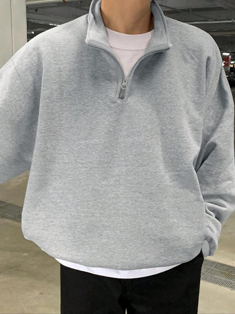 Close-up of the half-zip detail on a men's comfortable cotton blend fleece sweatshirt