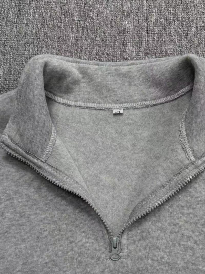 Detail of the fleece fabric on a men's stylish half-zip sweatshirt, emphasizing warmth and comfort