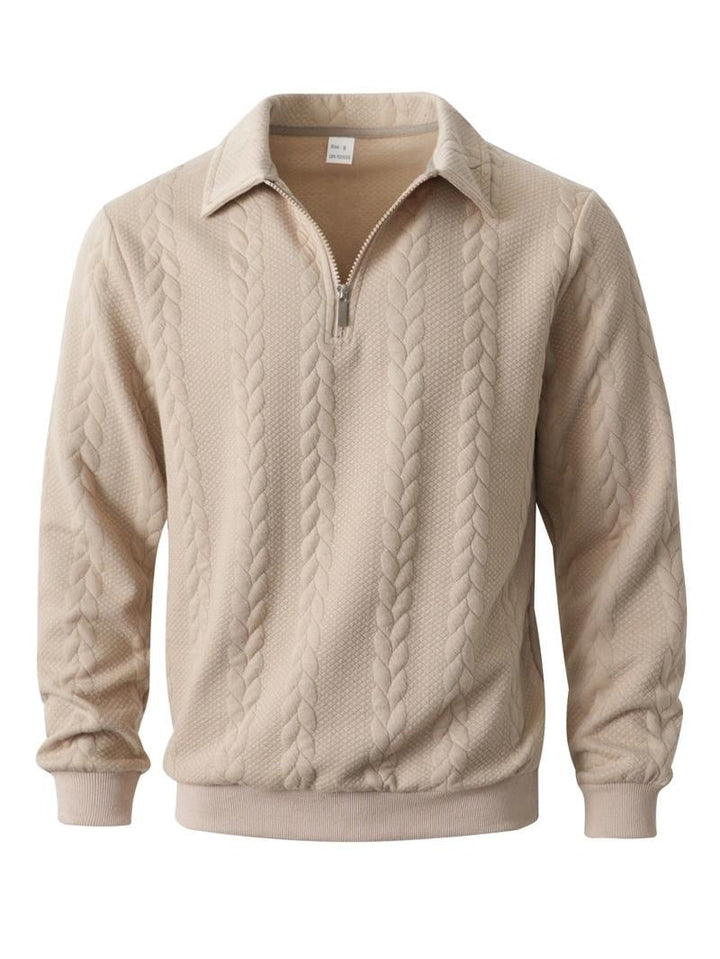 Folded men's dark green half-zip knit pullover sweater, showcasing the textured polyester knit.