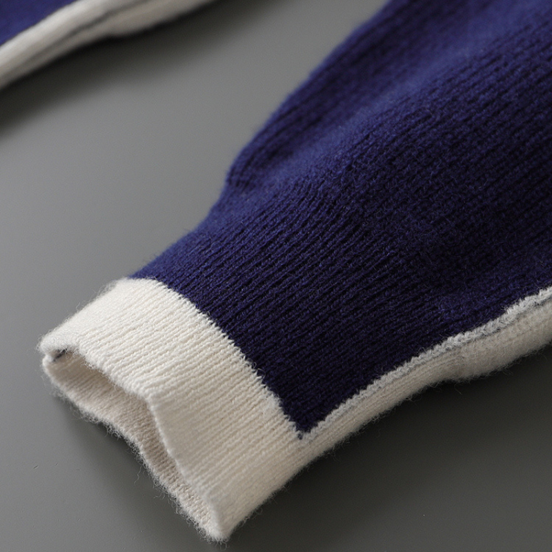 Stylish men's striped knit crewneck sweater in neutral tones with bold color contrast.