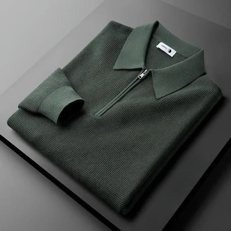 Close-up of men's navy blue zip polo sweater, fine cotton knit texture, versatile top
