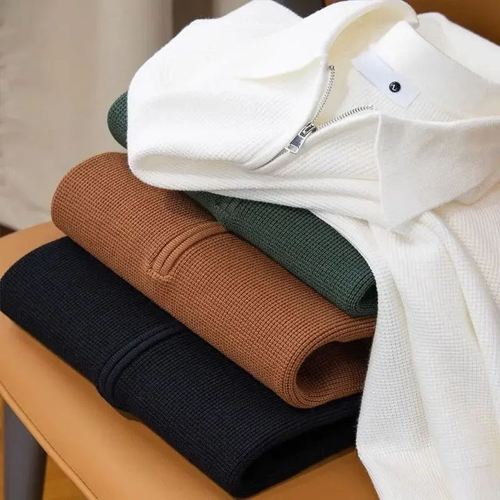 Folded green men's zip polo sweater, cotton knit fabric, a fashionable and versatile top