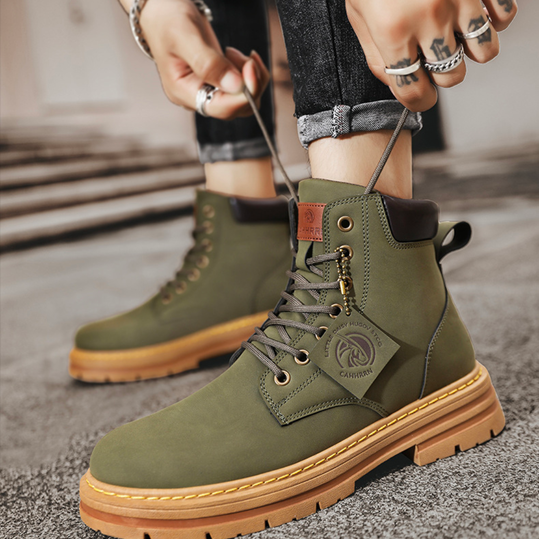 Green men's heavy-duty lace-up ankle boots, offering rugged footwear for outdoor adventures.