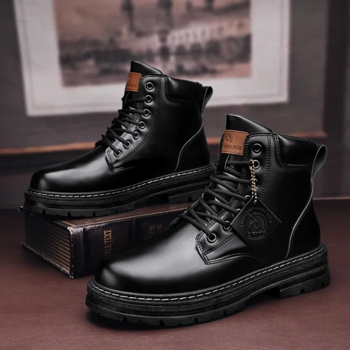 Close-up of the durable construction on men's heavy-duty lace-up ankle boots.