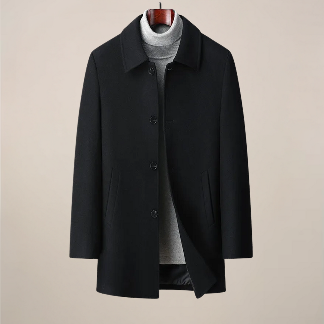 Full shot of a man wearing a smart casual herringbone car coat, perfect for business or leisure.