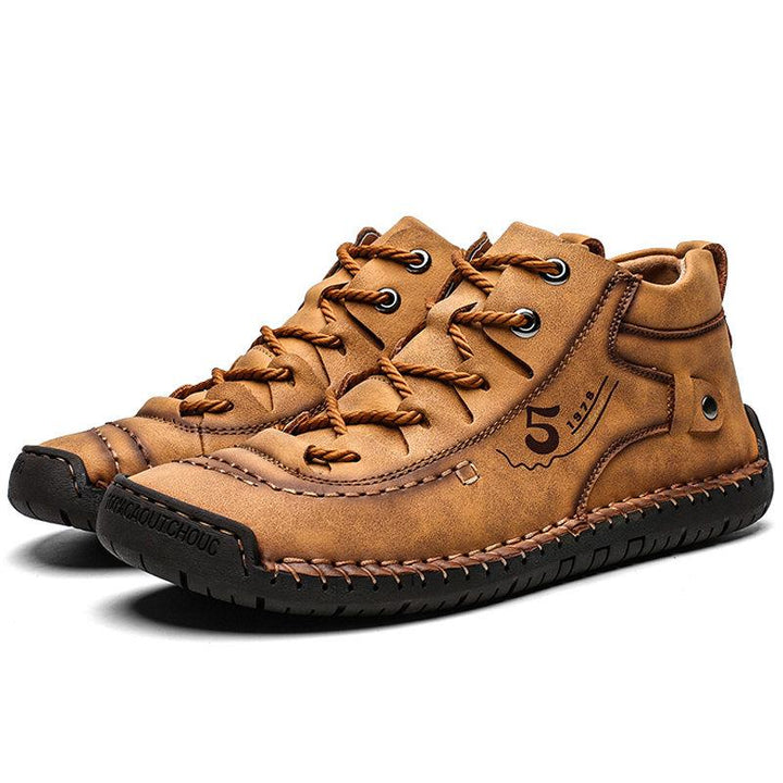 Detail of the exquisite hand-stitching on men's high-top cowhide leather boots, casual style
