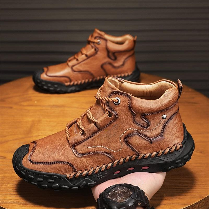 Close-up of men's brown leather high-top orthopedic comfort shoes, showing detailed stitching
