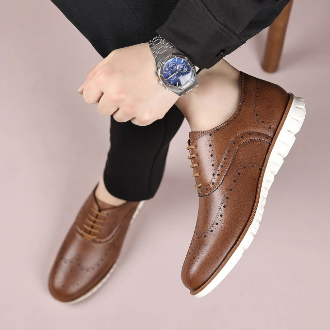 Side view of a men's brogue sneaker, showcasing its comfortable sole and sophisticated design.