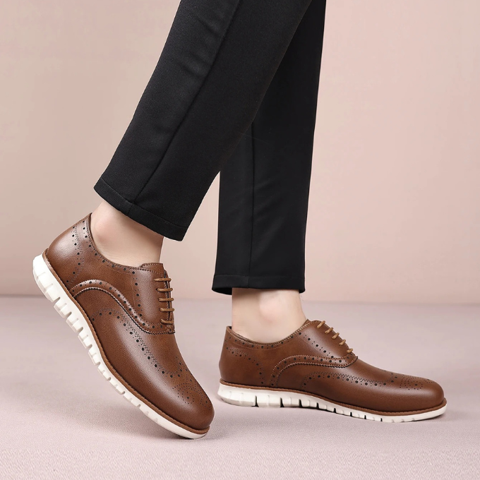 Men's hybrid brogue dress sneakers on a white background, highlighting their versatile appeal.