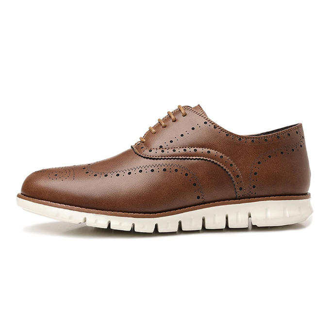 Detailed view of the sole and leather texture on a men's hybrid brogue dress sneaker.