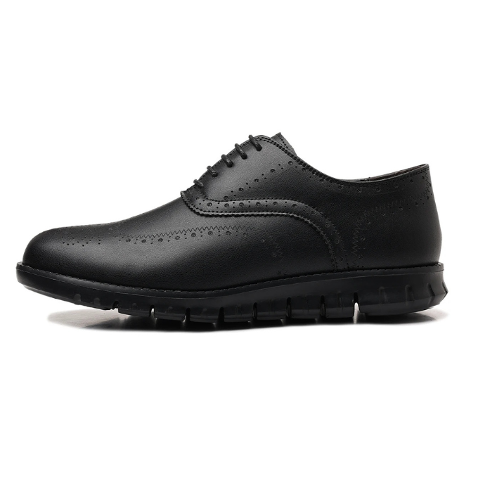 Man wearing men's brogue dress sneakers, demonstrating their fit and contemporary aesthetic.
