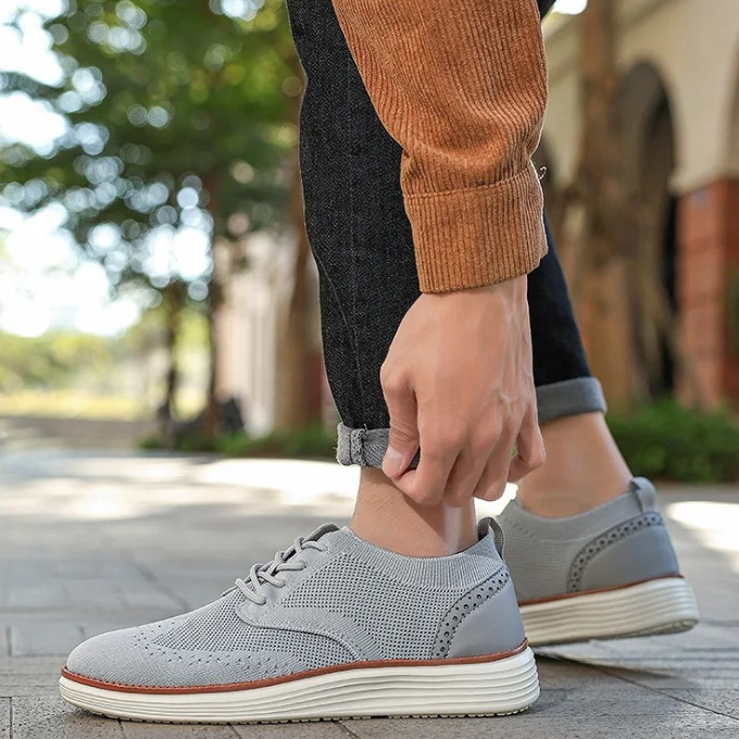 Men's wingtip hybrid dress sneakers, suitable for office wear or a smart-casual weekend look.