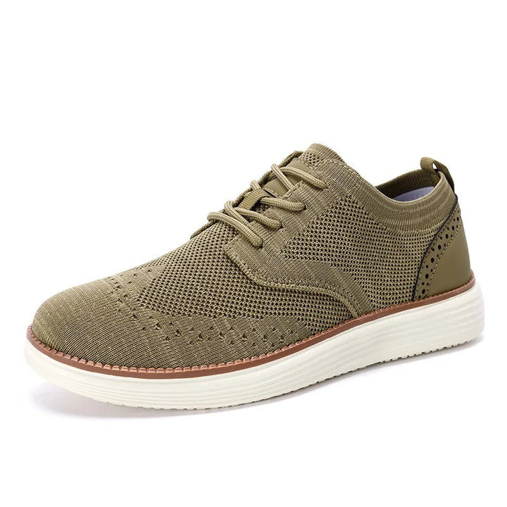 Comfortable and versatile men's hybrid shoes, featuring a sporty sole with an elegant wingtip design.
