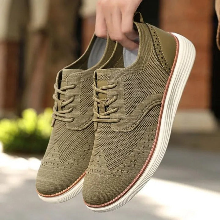Comfortable men's hybrid dress sneakers, blending formal wingtip styling with a sporty, versatile sole.