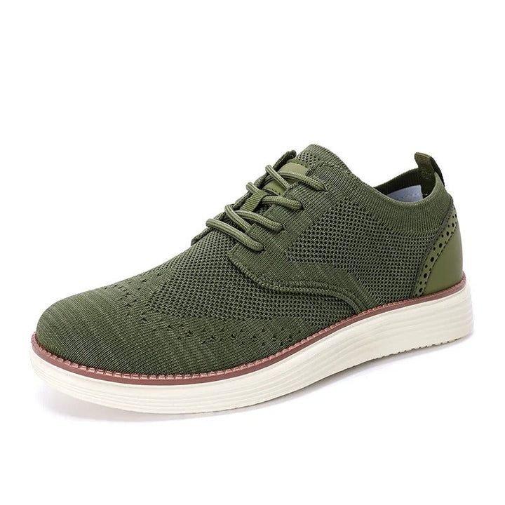 Close-up of the sole and heel of a men's hybrid dress sneaker, highlighting its comfortable design.