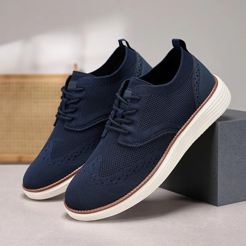 Men's wingtip hybrid dress sneakers, designed for all-day comfort with a stylish knit upper.