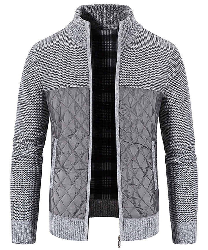 Lifestyle image of a Men's Hybrid Quilted Sweater Jacket being worn outdoors, perfect for fall fashion