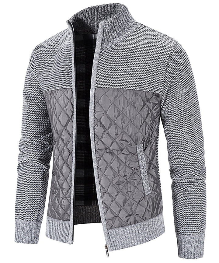 Folded Men's Hybrid Quilted Sweater Jacket, displaying its compact and travel-friendly design as outerwear