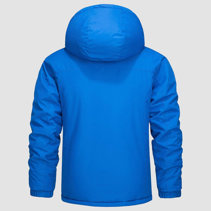 Model demonstrating the flexibility of a men's water-resistant insulated outdoor jacket.