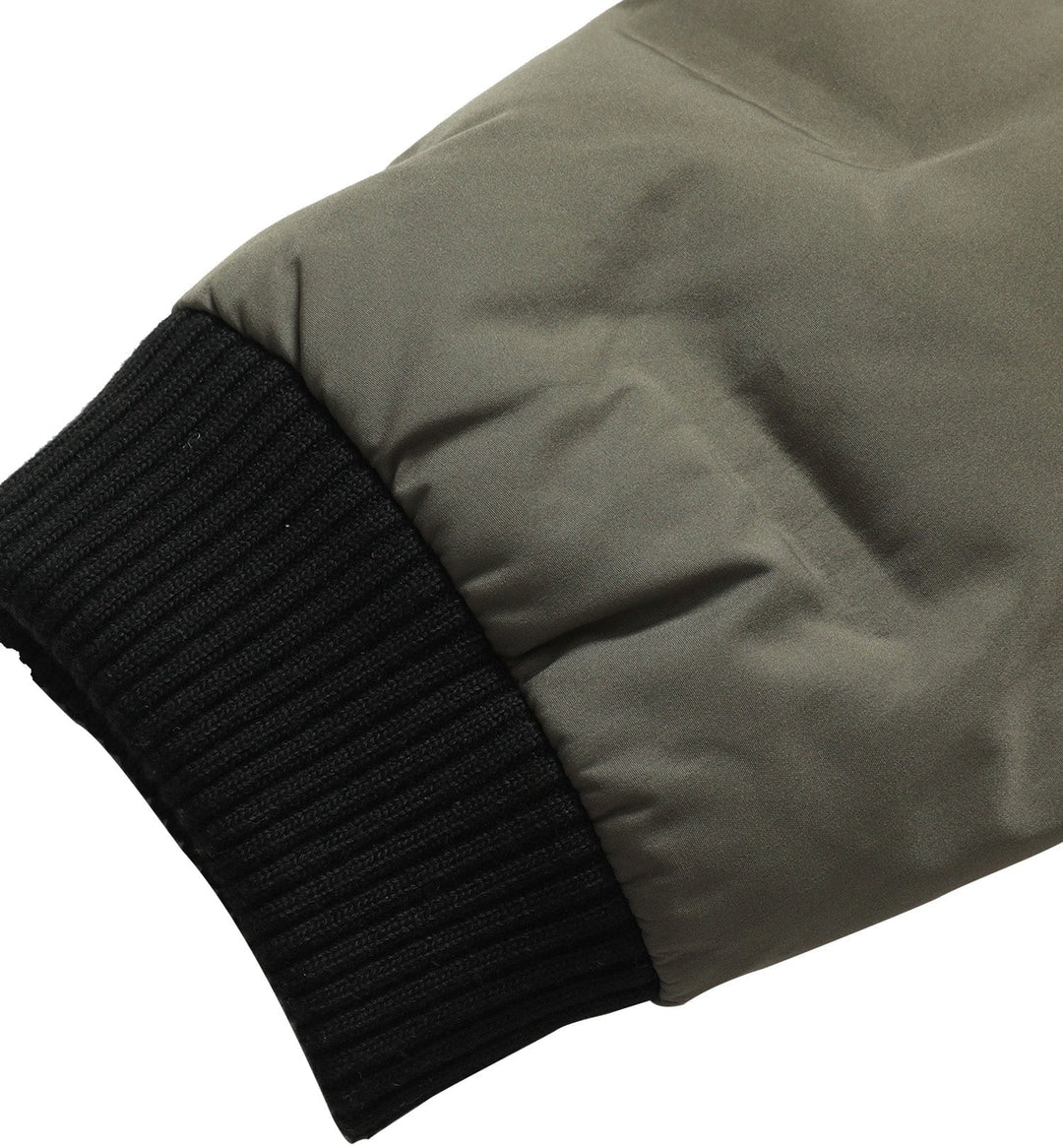 Close-up of the collar on a men's insulated bomber jacket, offering warmth and style.
