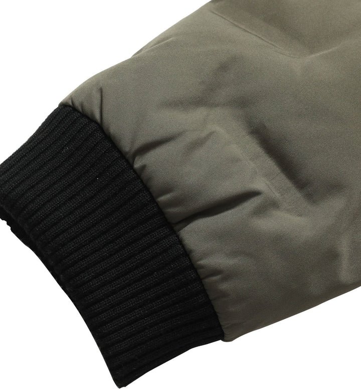 Close-up of the collar on a men's insulated bomber jacket, offering warmth and style.
