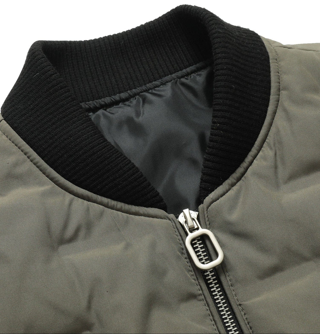 Side profile of a men's insulated bomber jacket, highlighting its fit and casual outerwear look.
