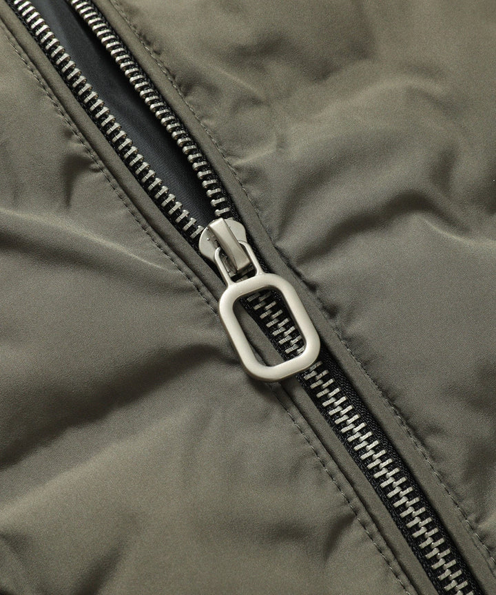 Back view of an army green men's puffer bomber jacket, a key piece of winter streetwear.