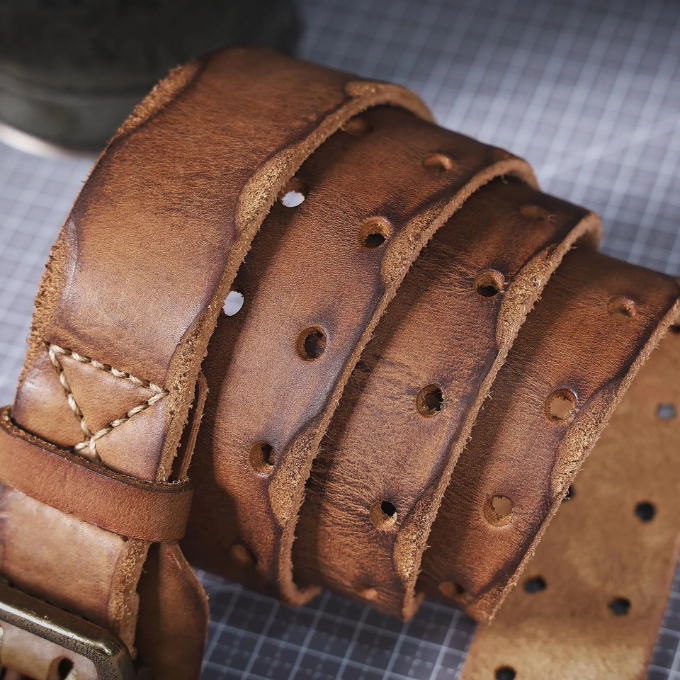 Full shot of a men's distressed Italian leather belt, ideal for casual and workwear outfits.