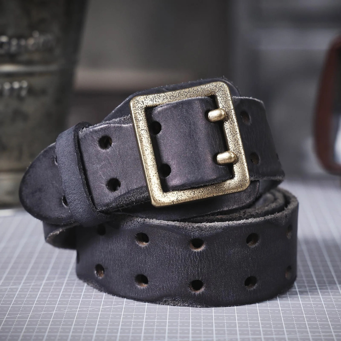 Detail view of the high-quality Italian leather of a men's vintage-style belt.